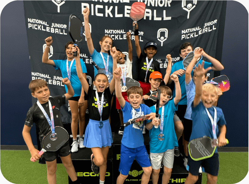 National Junior Pickleball - Group of joyful kids celebrating their wins at a pickleball tournament, holding paddles and medals